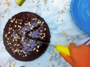 cutting zucchini chocolate cake