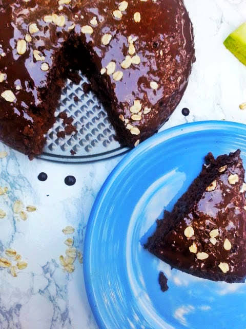This delicious vegan zucchini chocolate cake has a great moist consistency without eggs and dairy, while is so easy to make.  It's healthy, gluten-free, and allergy-friendly (dairy-free, egg-free, soy-free, corn-free, peanut-free, tree nut-free). Perfect for a birthday cake, or any other occasion. #chocolate #zucchini #chocolatecake #glutenfree #glutenfreedessert #dairyfree #healthydessert #easyrecipe #glutenfreedairyfree #dairyfree #eggfree #vegan #veganglutenfree