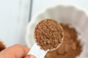Adding Cocoa Powder to a bowl