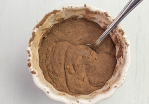 Mixing cocoa powder and maple syrup in a bowl
