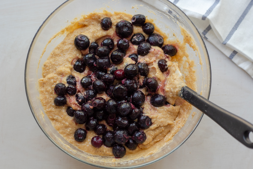 Adding blueberries to the dough