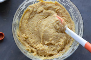 Bowl with almond flour added to the egg and sugar mixture