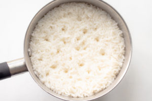a saucepan with cooked rice
