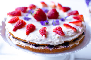 Gluten-free Vegan Vanilla Cake on a cake stand