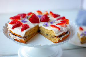 Gluten-free Vegan Vanilla Cake with a piece missing