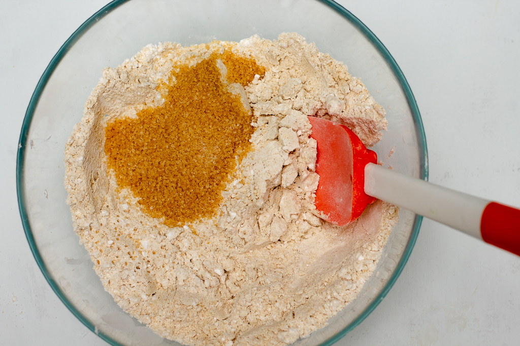 bowl with dry ingredients and sugar added to it