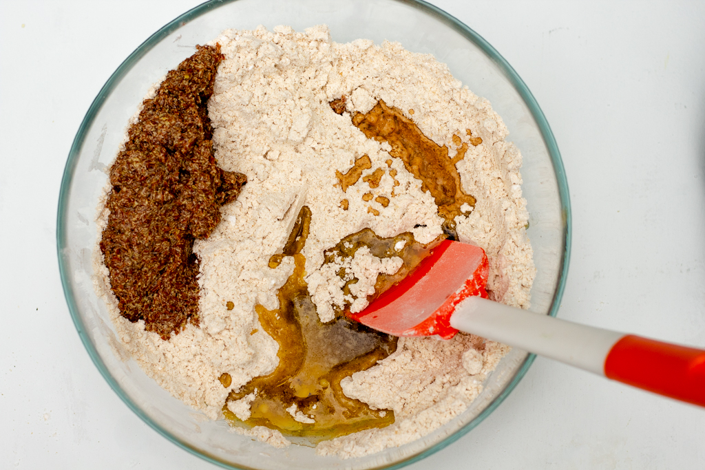 Bowl with dry ingredients and oil and flax egg added to it