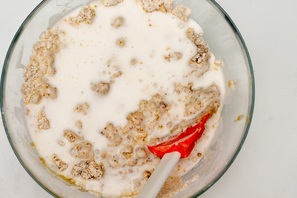 Bowl with dough and coconut milk added to it