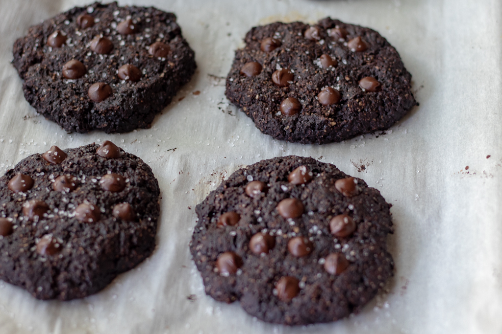 Vegan Chocolate Cookies on a cookie sheet lined with parchment paper