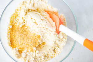 A bowl with almond flour, coconut flour, and sugar