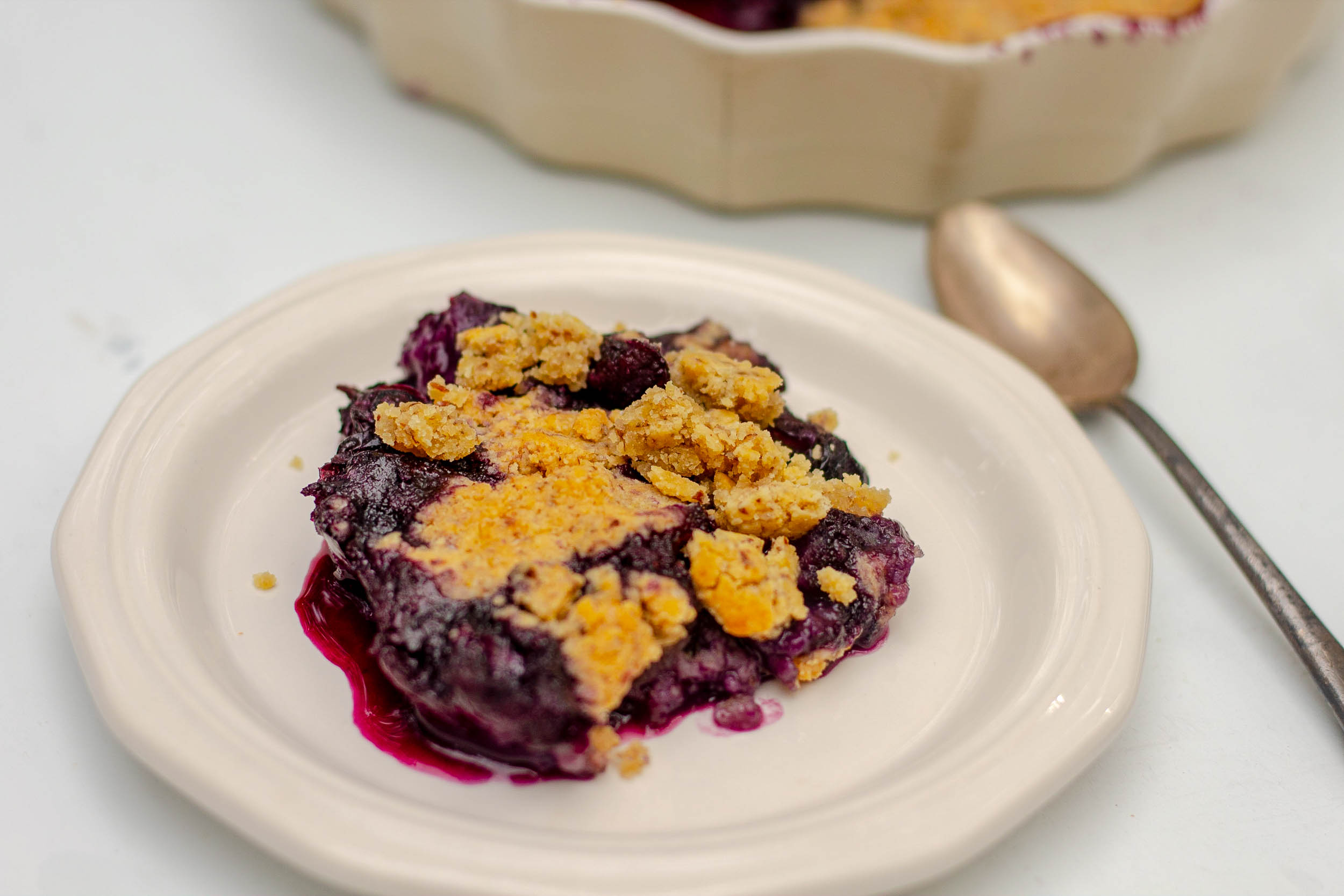 a piece of Gluten-free Blueberry Cobbler on a plate