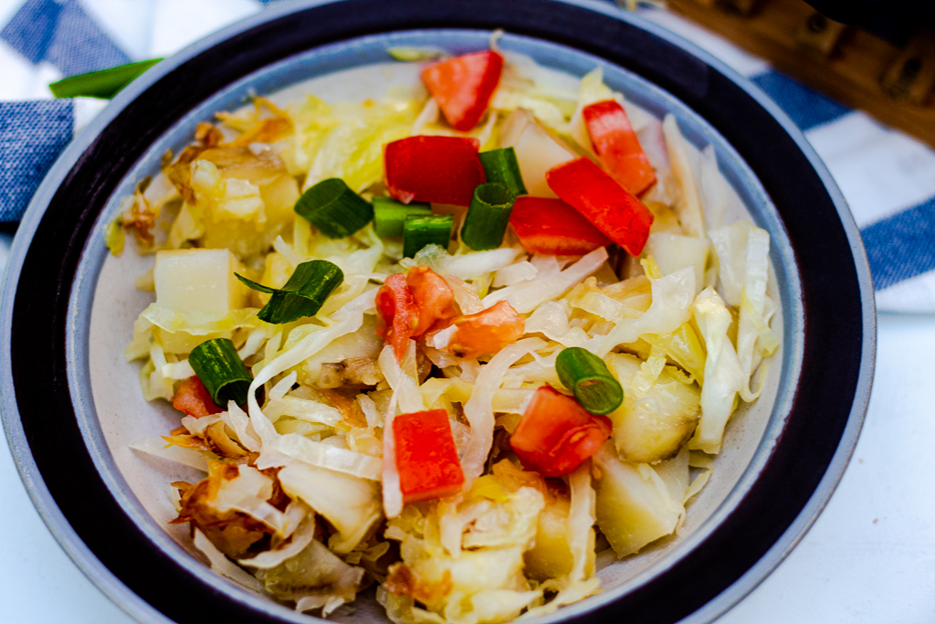 A bowl with Healthy Fried Cabbage and Potatoes