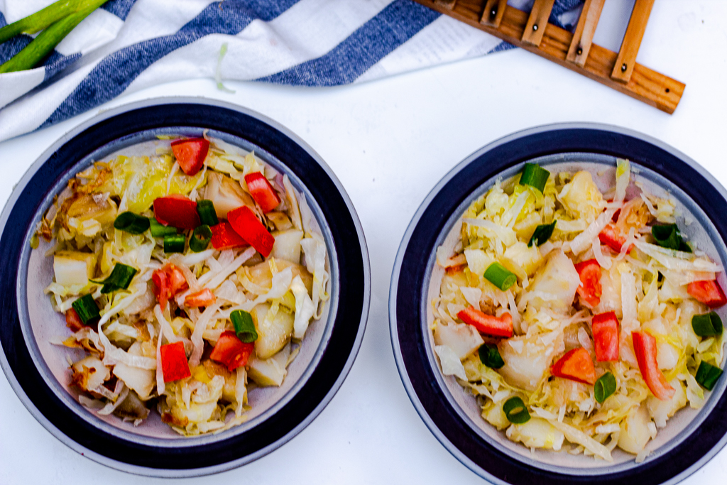 Healthy Fried Cabbage and Potatoes in two bowls