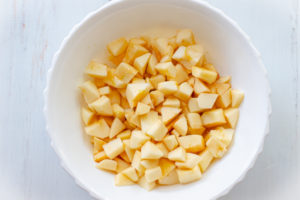 Cut up apples in a white bowl