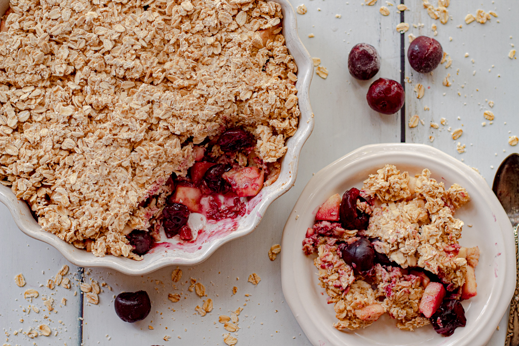 Healthy Apple Crisp in a pie pan and some on a plate