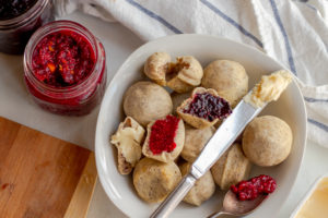 Vegan Gluten-free Dinner Rolls in a bowl with chia jam