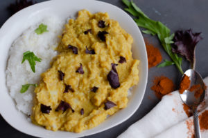 A bowl of curry over rice