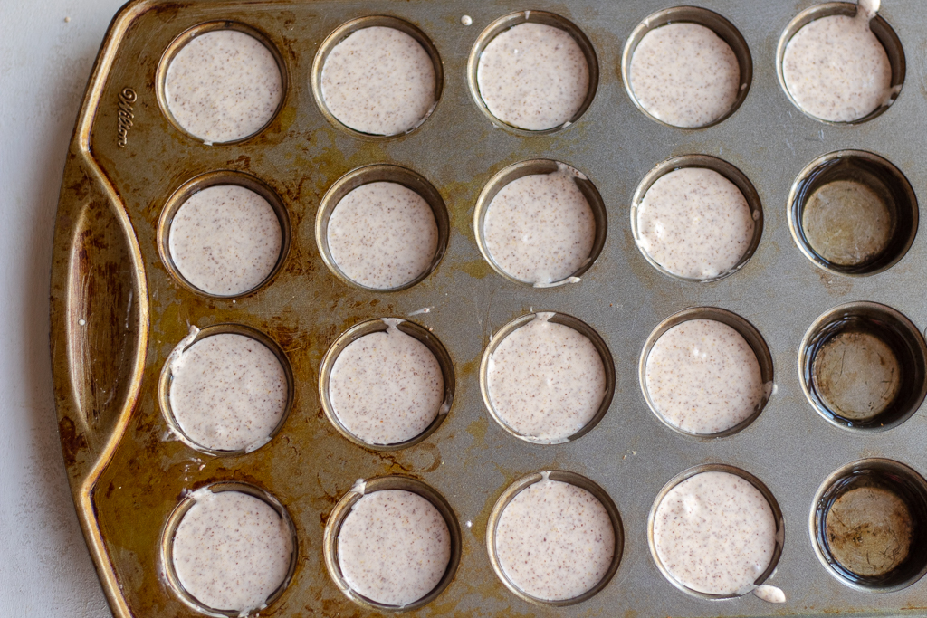 Vegan Gluten-free Dinner Rolls dough in a mini-muffin pan