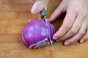 someone cutting an onion