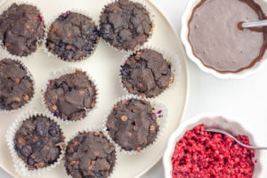 Chocolate Blueberry Paleo Cupcakes with chocolate ganache and raspberry topping