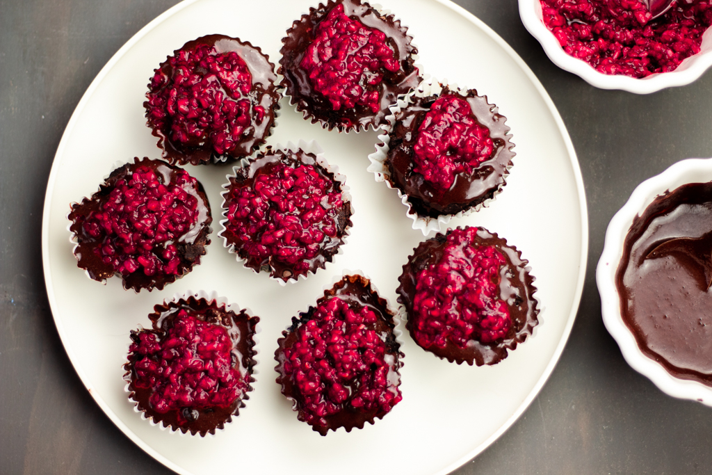 Chocolate Blueberry Paleo Cupcakes with chocolate ganache and raspberry topping