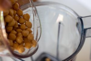 Adding chickpeas to the blender