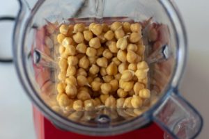 chickpeas and water in a blender
