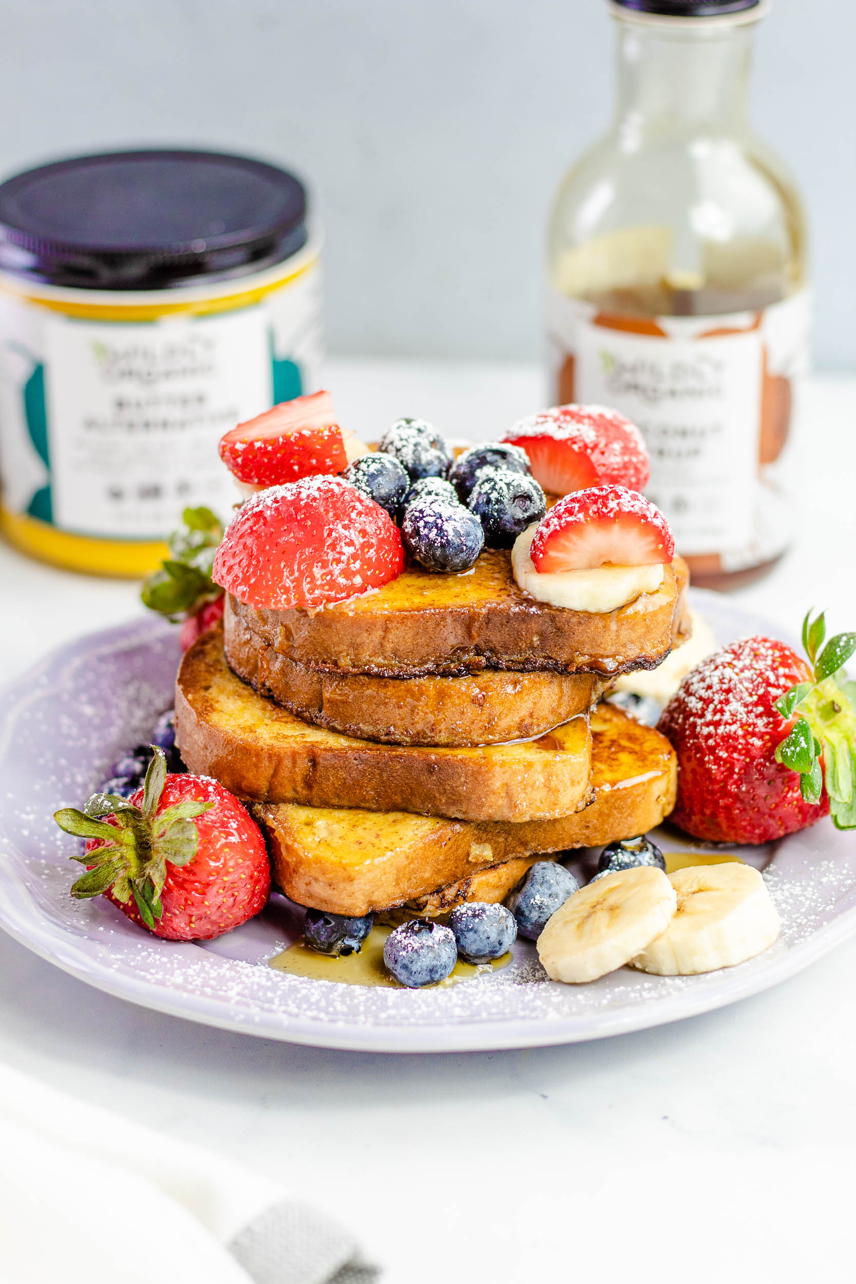 French toast on a plate covered with fresh fruit