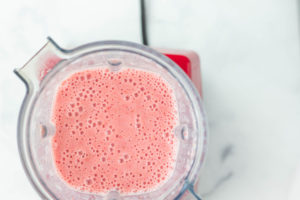 Strawberry smoothie blended in the blender